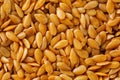 Background texture of white flax seeds. Useful cereals.