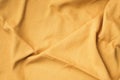 Background texture of yellow fabric texture. Copy space. Top View of cloth textile surface. Abstract backdrop for design