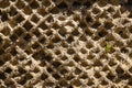 A background textured image of the masonry remains of a ancient building with the bricks eroded away