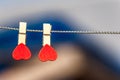 Background on a theme of love. Pins in the form of hearts against the blue sky Royalty Free Stock Photo