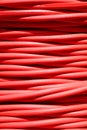 background of thick red electrical cable used for high-voltage power transmission Royalty Free Stock Photo