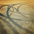Background with tire marks on the asphalt - retro photo effect. Royalty Free Stock Photo