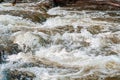 Background, top view, rapid flow river with dark blue water and white foam waves Royalty Free Stock Photo