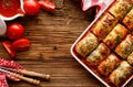 Background with traditional polish dish of cabbage, cabbage rolls stuffed with groats and mushrooms with tomato sauce Royalty Free Stock Photo