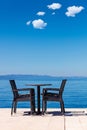 Background of two chairs and beach and small bag and table place Royalty Free Stock Photo