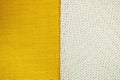 Background from two part yellow textile and white knitting cloth, copy space.