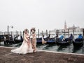 Venetian romantic couple masks masquerade in Venice italy