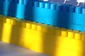 Background Ukraine Flag brick wall, childish cubes. Bright toys