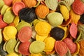 Background - uncooked colorful durum wheat semolina orecchiette pasta with the addition of the special ingredients