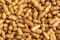 Background of unpeeled peanuts in the shell. Full frame top view of the scattered nuts Royalty Free Stock Photo