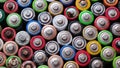 Background with used batteries folded in the center, types: AAA, AA, top view. Toxic pollution