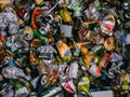 Background from used metal aluminum trash cans in a dumpster disposed for recycling Royalty Free Stock Photo
