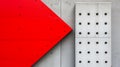 Background, Using One Color In Bright Red, And Using One Geometric Of Dotted - A Red And White Triangular Object Next To A White