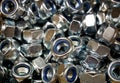 Background of a variety of metal self-locking nuts Royalty Free Stock Photo