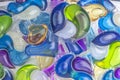 Background of various capsules with laundry detergent and dishwasher soap Royalty Free Stock Photo