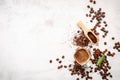 Background of various coffee , dark roasted coffee beans , ground and capsules with scoops setup on white concrete background with Royalty Free Stock Photo