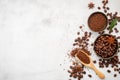 Background of various coffee , dark roasted coffee beans , ground and capsules with scoops setup on white concrete background with Royalty Free Stock Photo