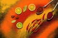 Background of various spices, red, orange, yellow. Paprika, turmeric, anise, bay leaf, chilli pepper, lime, saffron. Assorted spic