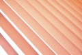 Background of vertical orange blinds curtains. Pleated roller blinds. Orange striped background Royalty Free Stock Photo