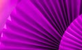 Background with vibrant large magenta purple paper oriental craft fans.Dark texture banner with deep shadows.Chinese New