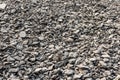 Background view: Heaps of bits and pieces of asphalt stones taken from demolished roads