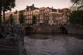 Typical dutch houses and bicycles beside the canal at sunset, Amsterdam, the Netherlands Royalty Free Stock Photo