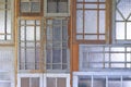 Background of Vintage interior Wall made of many the old wooden windows with patterned glass Royalty Free Stock Photo