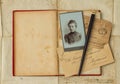 Background with vintage photo, postcards, and empty open book