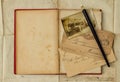 Background with vintage photo, postcards, and empty open book Royalty Free Stock Photo