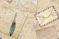 Background in vintage style with hand written letters, post stamps, envelopes, fountain feathers pen Royalty Free Stock Photo