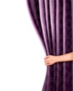 Background with violet velvet curtain and hand.