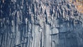 Background with volcanic basalt columns. Stone formation.