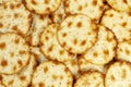 Wafer thin golden brown round crackers