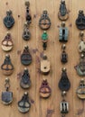 Background Wall of Old Metal and Wooden Pulleys