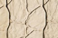 Background wall texture with large stone tiles in light colors. Royalty Free Stock Photo