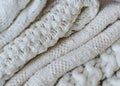 Background with warm sweaters. Pile of knitted clothes in warm shades, space for text, Autumn winter concept. Copy Space. Royalty Free Stock Photo