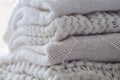 Background with warm sweaters. Pile of knitted clothes in warm shades, space for text, Autumn winter concept. Copy Space. Royalty Free Stock Photo