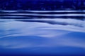 Background water blue, waves with blue bokeh Royalty Free Stock Photo