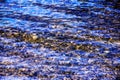 Background of the water of Lake Traunsee in the coastal area. Colorful texture of stones under water Royalty Free Stock Photo