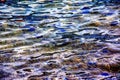 Background of the water of Lake Traunsee in the coastal area. Colorful texture of stones under water Royalty Free Stock Photo