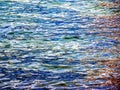 Background of the water of Lake Traunsee in the coastal area. Colorful texture of stones under water Royalty Free Stock Photo