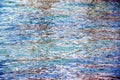 Background of the water of Lake Traunsee in the coastal area. Colorful texture of stones under water Royalty Free Stock Photo