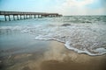 Background of waves beating on a sandy beach in stormy weather Royalty Free Stock Photo