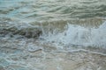 Background of waves beating on a sandy beach in stormy weather Royalty Free Stock Photo