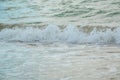 Background of waves beating on a sandy beach in stormy weather Royalty Free Stock Photo