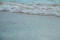 Background of waves beating on a sandy beach in stormy weather Royalty Free Stock Photo