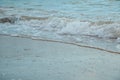 Background of waves beating on a sandy beach in stormy weather Royalty Free Stock Photo