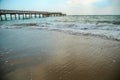 Background of waves beating on a sandy beach in stormy weather Royalty Free Stock Photo