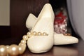 Wedding gold rings on the bride's shoes