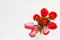 Background Wedding Or Valentine`s Day. Red And Pink Tulips Bouquet On A Wooden Table. Flat Lay.
